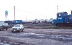 CR 8891 sits as 3114, 3083 work on a freight.